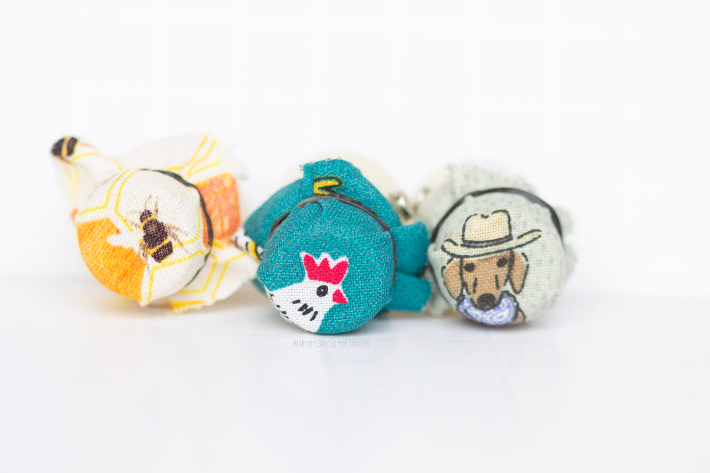 Different cotton fabrics that include bee, chicken/homestead, and cowboy dachshund